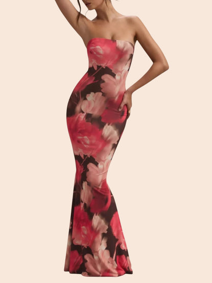My Store strapless mermaid maxi dress in a vibrant pink and black abstract floral print with a form-fitting silhouette.