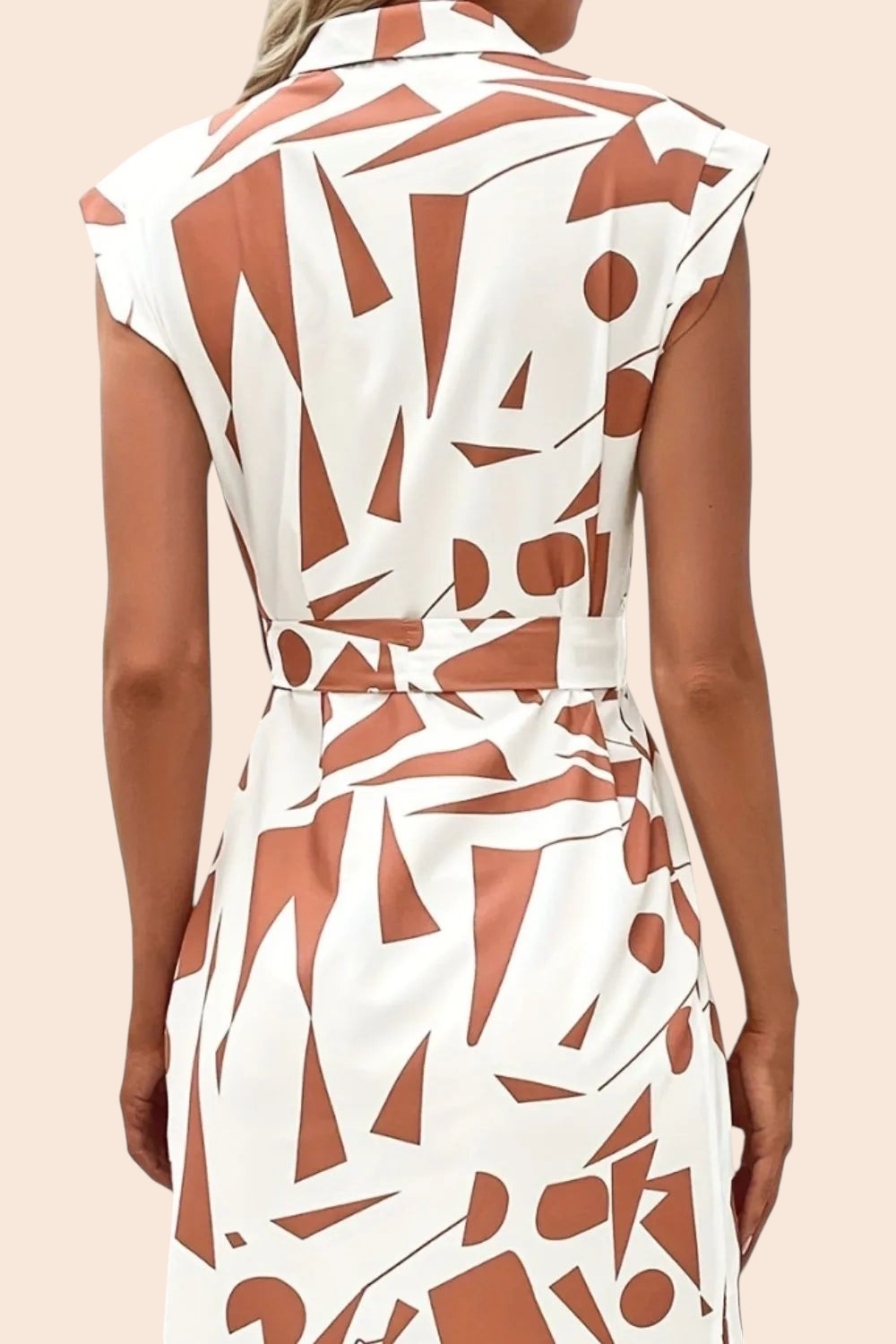 Back view of My Store midi dress featuring a white and brown abstract geometric print, cap sleeves, and a waist tie.