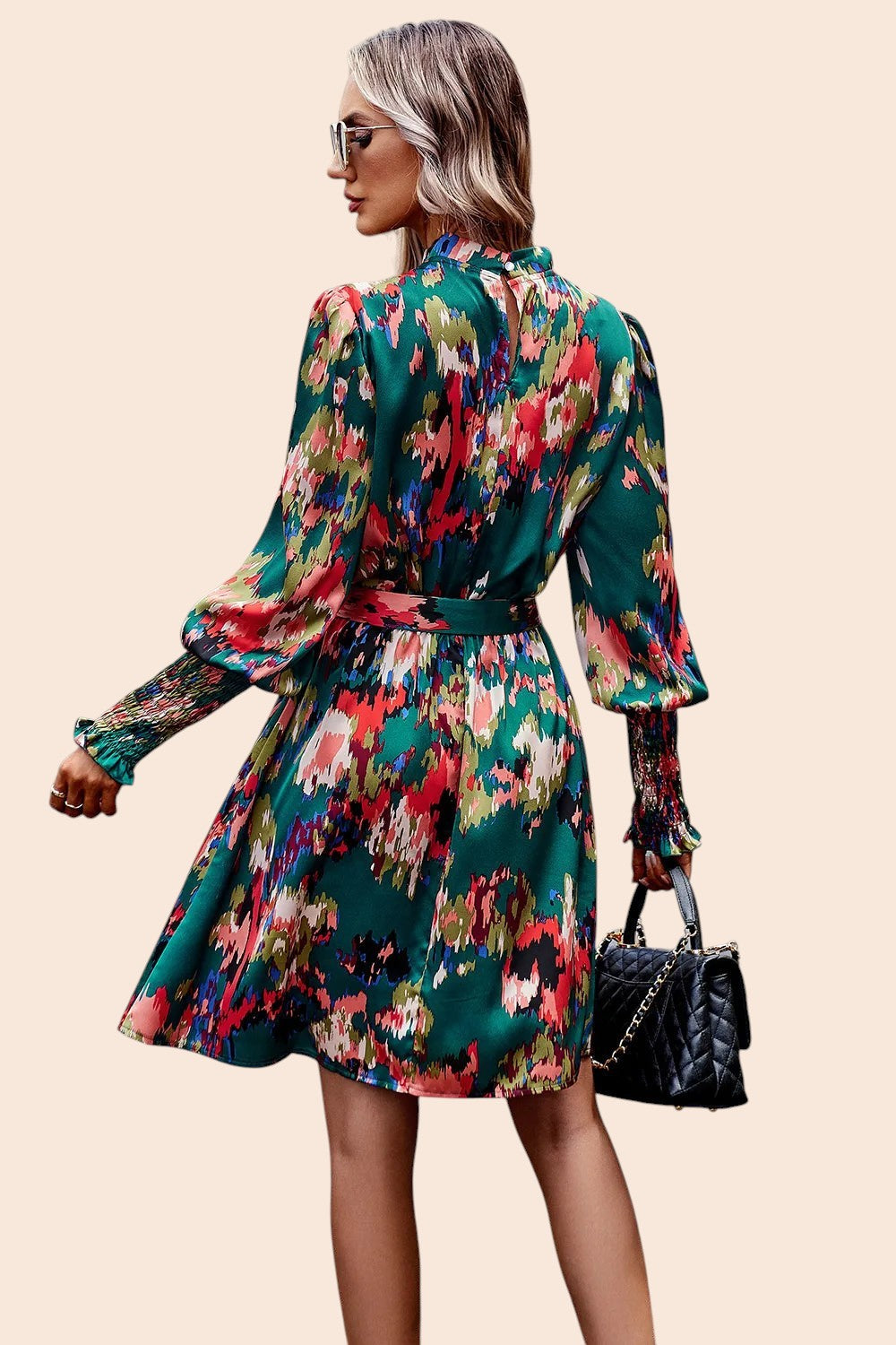 My Store abstract print mini dress with mock neck, voluminous sleeves, and waist tie worn by a model from behind