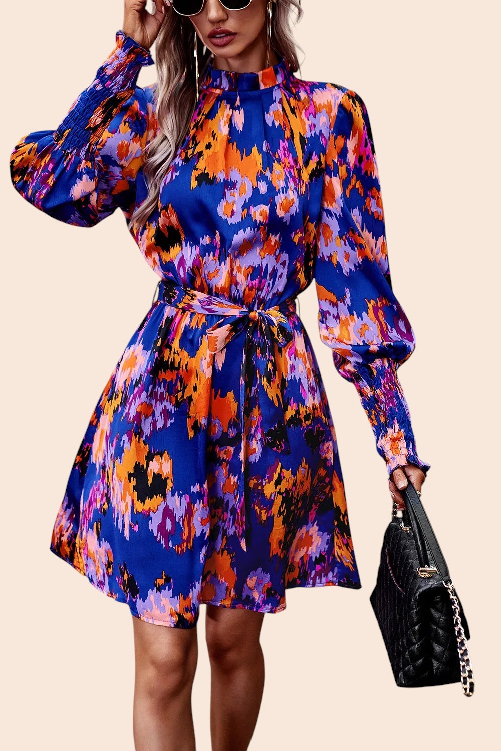 My Store abstract print mini dress with mock neckline, voluminous sleeves, and removable waist tie on a model.