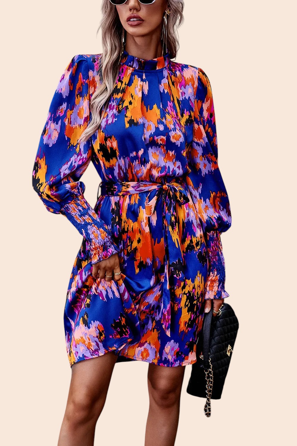 My Store abstract print mini dress with mock neck, voluminous sleeves, and removable waist tie in blue and orange.