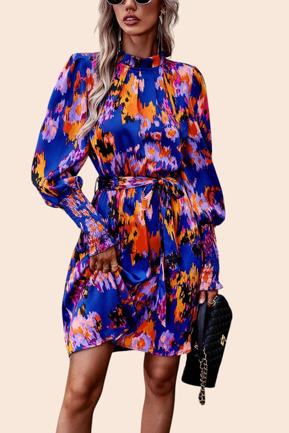 My Store abstract print mini dress with mock neck, voluminous sleeves, and removable waist tie in blue and orange.