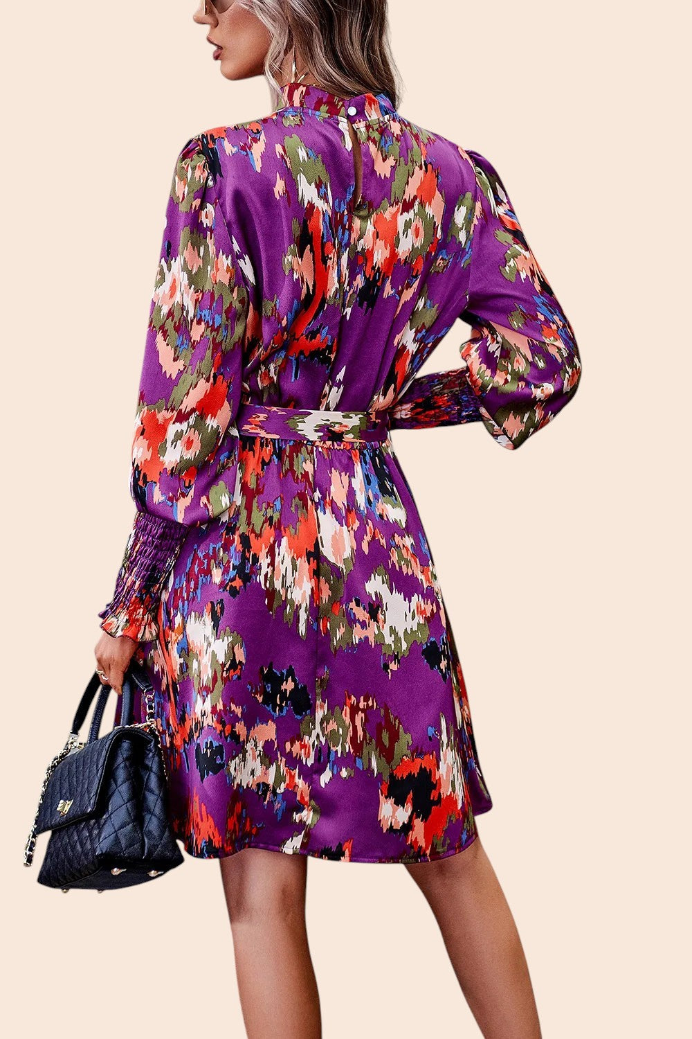 My Store abstract print mini dress with mock neck, long voluminous sleeves, and waist tie, shown from the back.