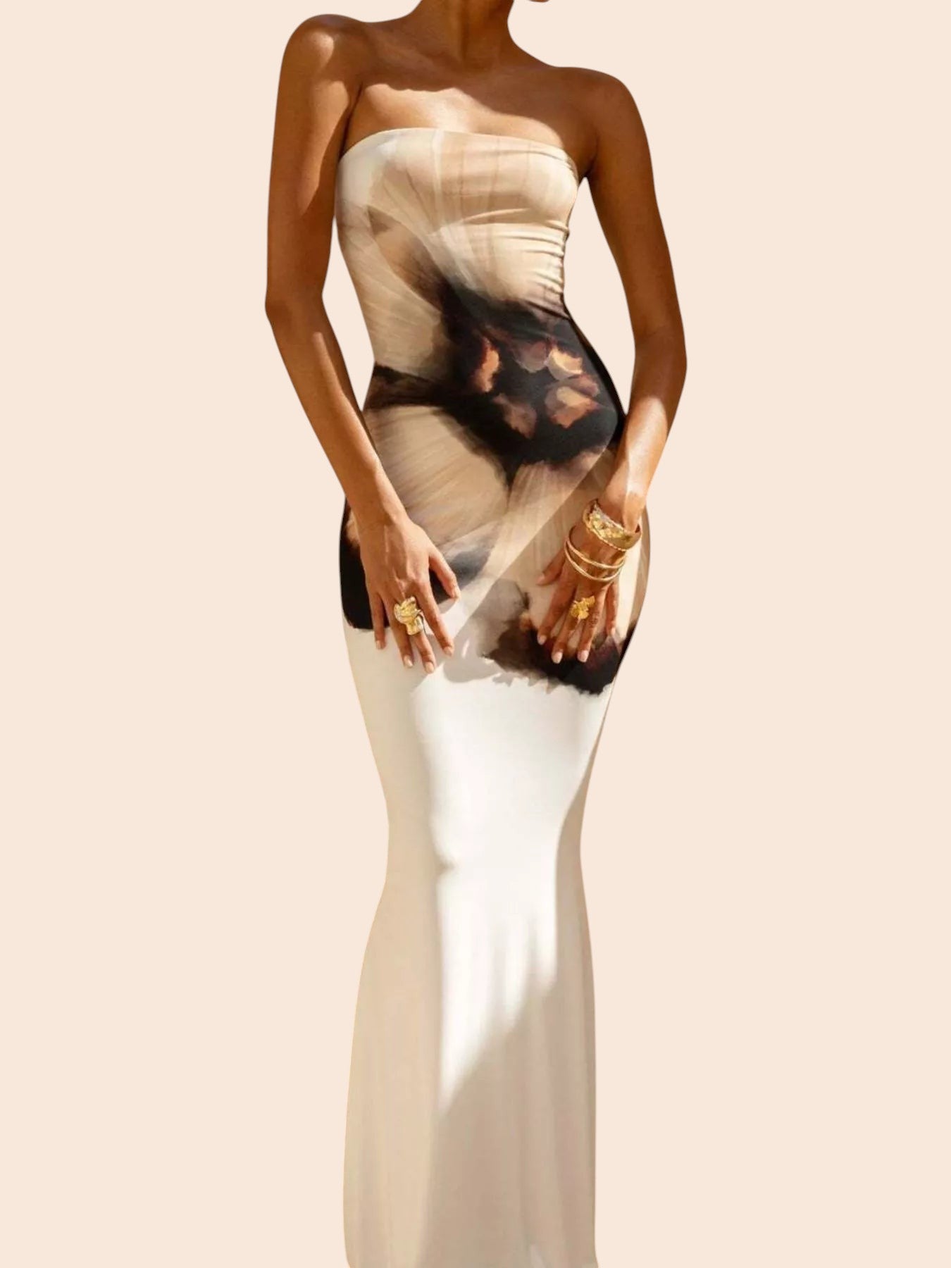 My Store abstract print strapless tube maxi dress with a mermaid hem worn by a model in a sunlit outdoor setting.