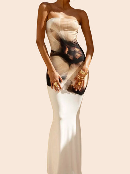 My Store abstract print strapless tube maxi dress with a mermaid hem worn by a model in a sunlit outdoor setting.
