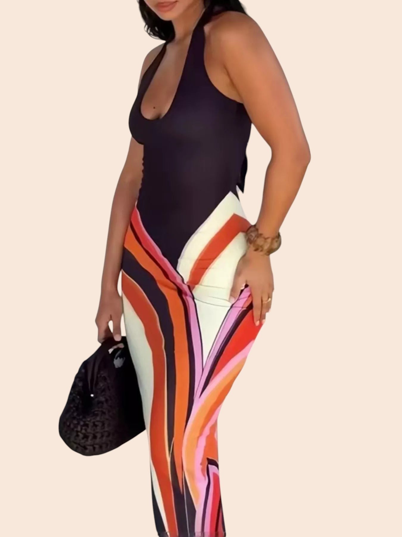 My Store abstract swirl print maxi dress with a black halter bodice and floor-length silhouette on a model