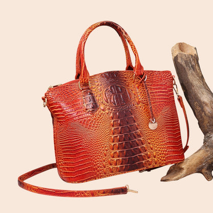My Store Amara croc-embossed top handle handbag in a vibrant orange and brown gradient with polished hardware.