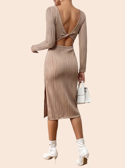 My Store beige textured midi dress with long sleeves, open twist-back detail, and side slit worn by a model