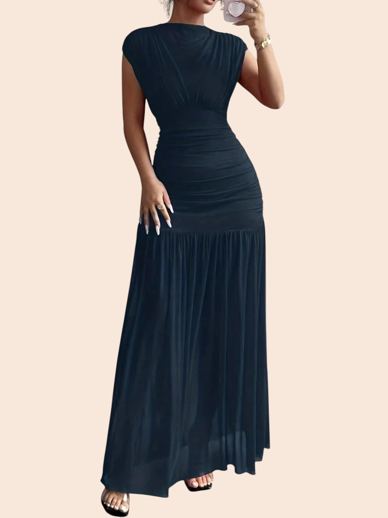 My Store black ruched drop-waist maxi dress with cap sleeves and a flowing skirt, worn by a woman in a mirror selfie.