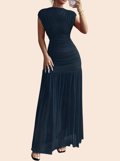 My Store black ruched drop-waist maxi dress with cap sleeves and a flowing skirt, worn by a woman in a mirror selfie.
