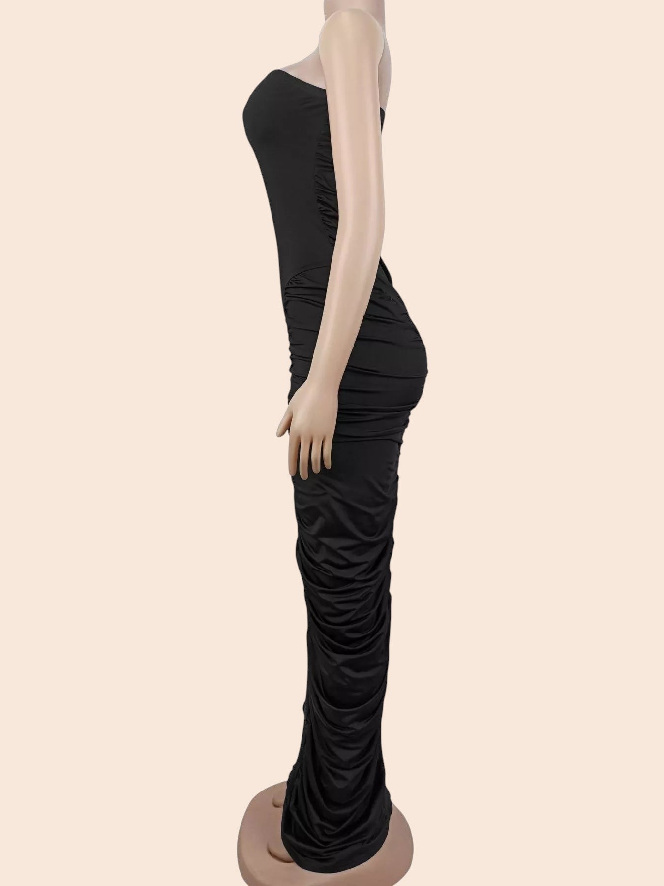 My Store black strapless maxi dress with all-over ruching on a mannequin, side view showing a bodycon silhouette.
