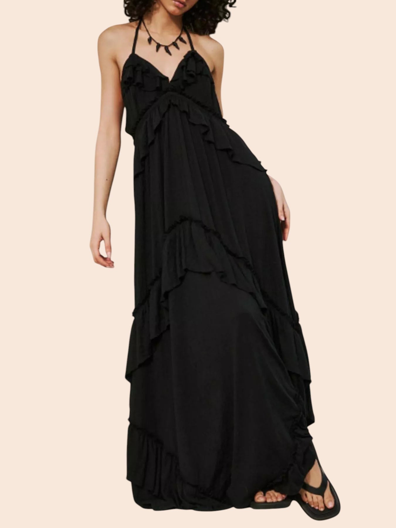 My Store black ruffled tiered halter maxi dress with an open back and flowing silhouette worn by a model