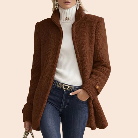 My Store brown textured fleece tailored jacket with an open front, worn over a white turtleneck and blue jeans.