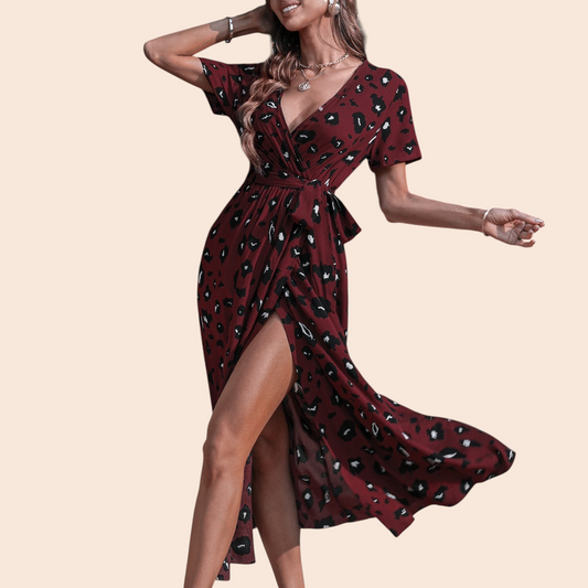 My Store burgundy floral wrap maxi dress with a V-neckline, tie waist, and dramatic front slit on a woman outdoors.