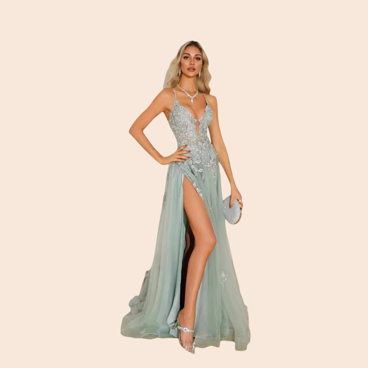 Model wearing a My Store Celeste sage green tulle evening gown with floral embroidery, plunging neckline, and high slit