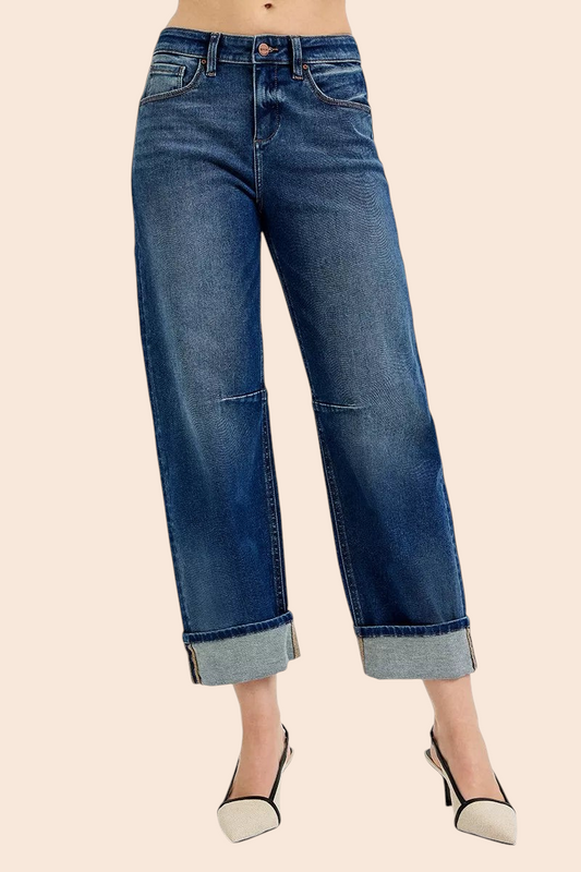 My Store dark-wash barrel-leg jeans with statement rolled cuffs and a cropped ankle length on a model in heels.