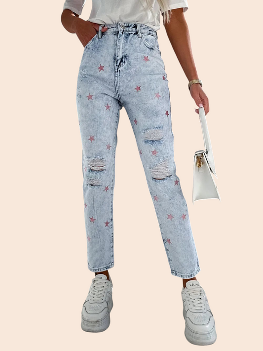 My Store light-wash straight-leg jeans with distressed rips and red star print, styled with a white tee and sneakers.