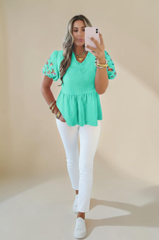 My Store teal textured blouse with embroidered floral puff sleeves and a frill V-neck. 100% polyester.