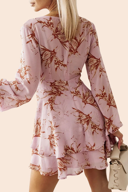My Store floral mini dress in light pink with long balloon sleeves and a tiered skirt, back view on a model.