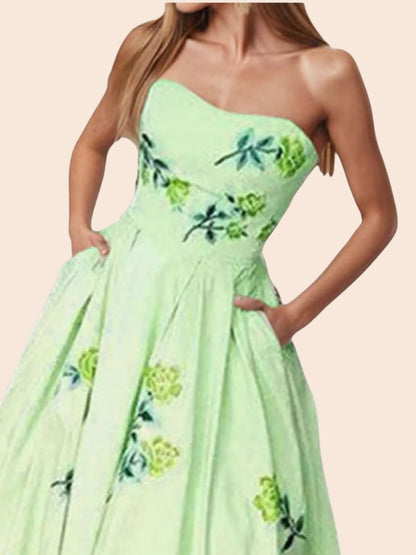 My Store strapless midi dress in light green with a delicate floral print, featuring a fitted bodice and side pockets.