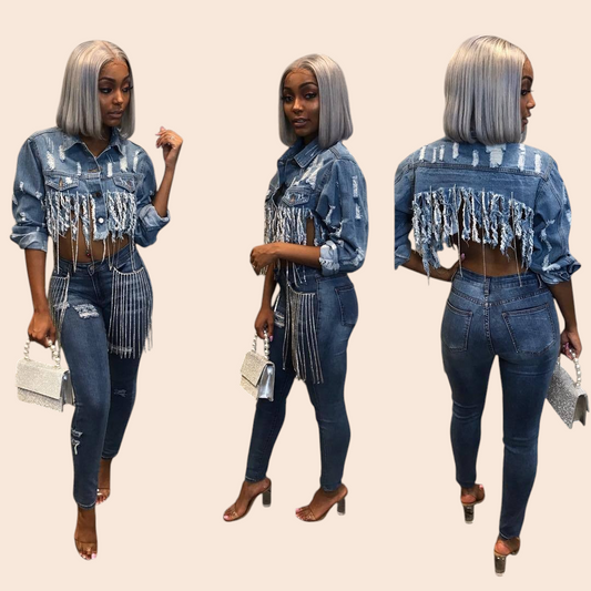 My Store cropped blue denim jacket with cascading fringe and distressed details worn by a woman with silver hair.