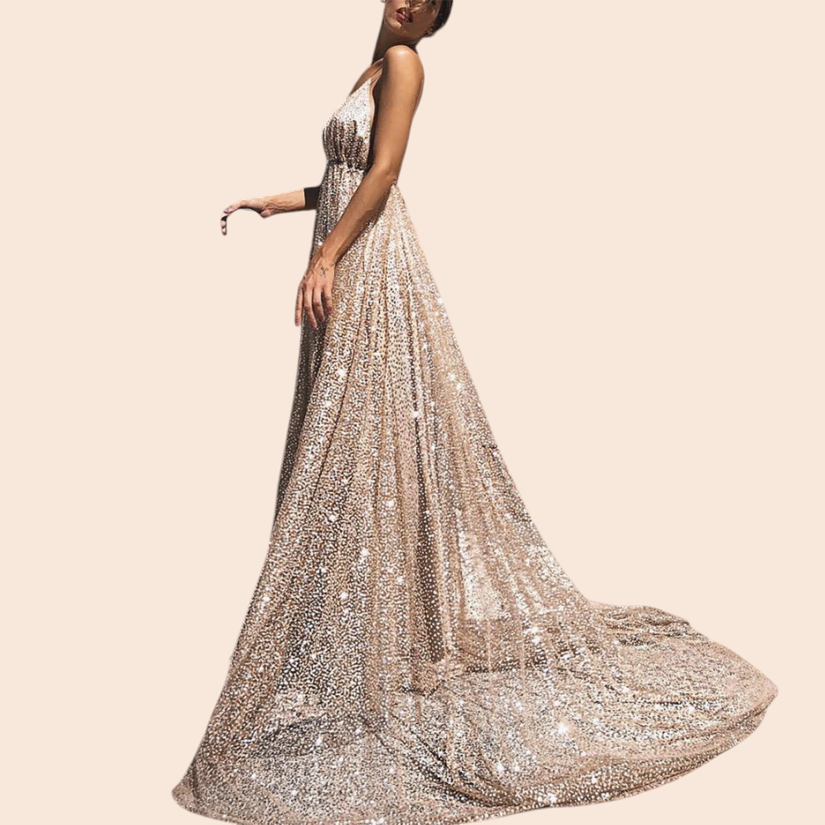My Store Aurelia gold shimmer plunge maxi gown with a deep V-neckline and full floor-length skirt on a stone street.