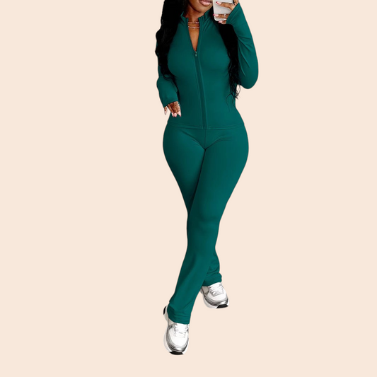 My Store dark green zip-up jacket and high-waisted pants activewear set worn by a woman with white sneakers