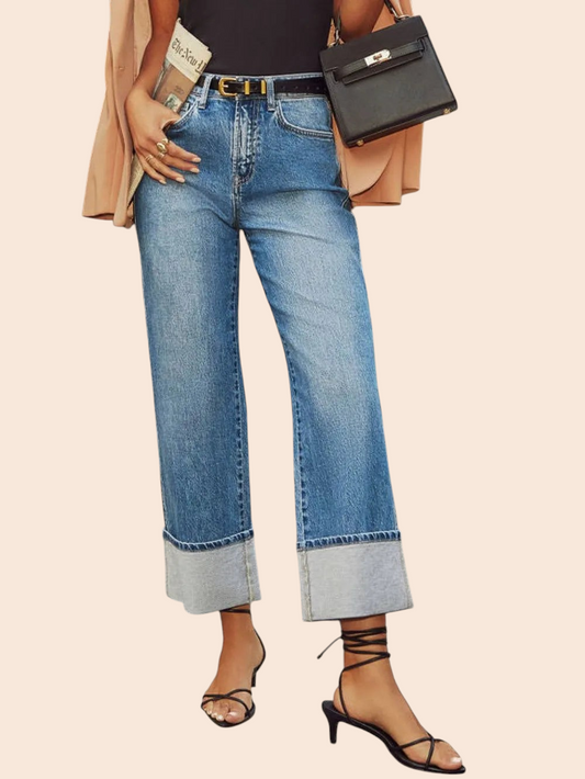 My Store high-waisted straight-leg jeans in medium blue denim with oversized rolled cuffs worn with strappy heels