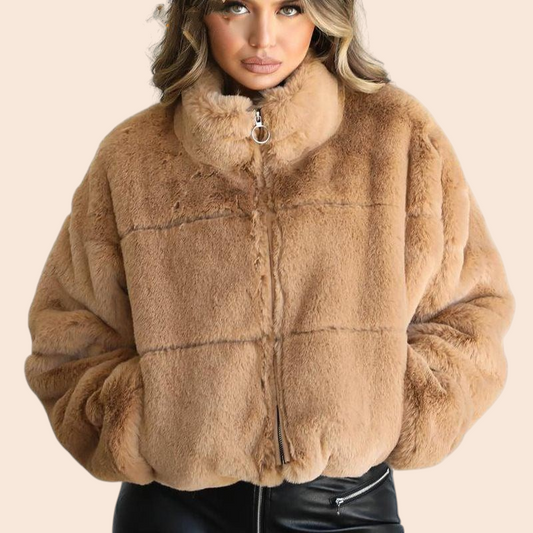 My Store plush faux fur zip-up jacket in khaki with a high neckline and relaxed fit worn by a woman