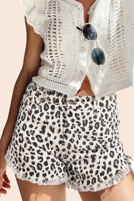 My Store leopard print high-rise denim shorts with a frayed hem paired with a white crochet top