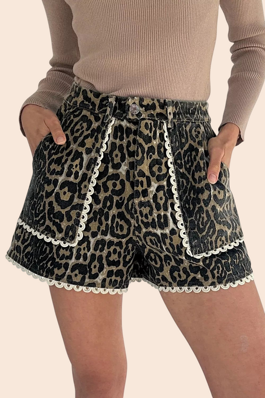 My Store leopard print denim shorts featuring white lace trim, front pockets, and a relaxed fit on a model.