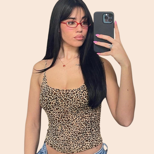 My Store leopard print cami top with spaghetti straps and scoop neckline worn by a woman taking a mirror selfie