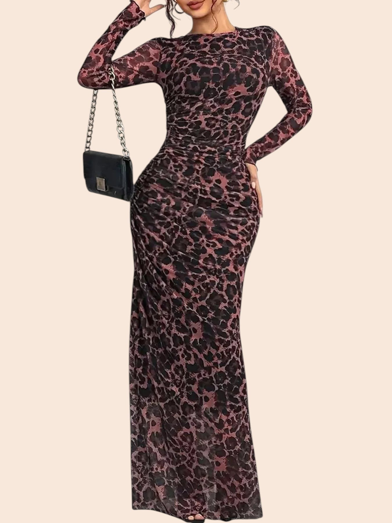 My Store leopard print long sleeve maxi dress in semi-sheer mesh with ruched detailing on a model holding a handbag.