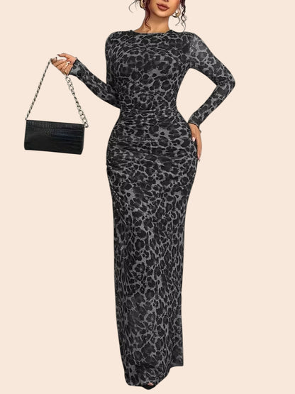 My Store leopard print long sleeve mesh maxi dress with ruched detailing and a side slit worn by a model