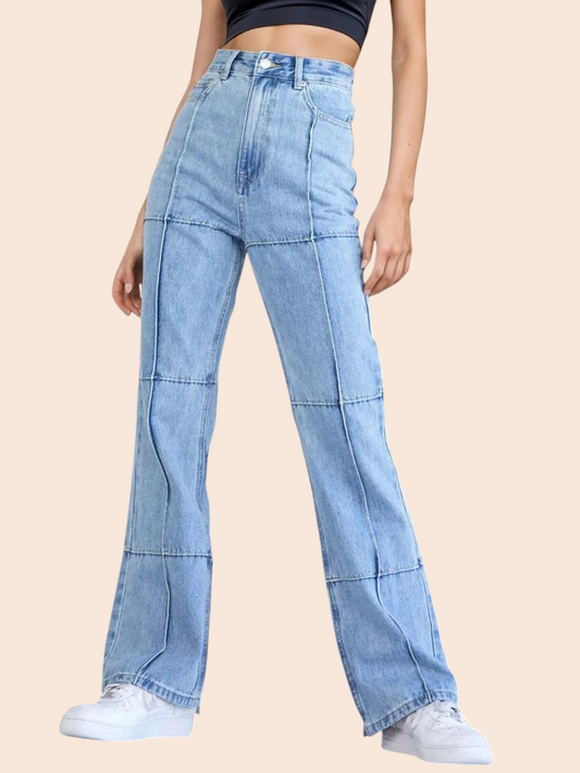 My Store high-rise light-wash straight-leg jeans with panelled detailing worn by a model on a wooden staircase