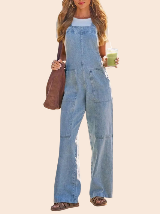 My Store light wash wide-leg denim overalls worn by a woman with a white tee, brown bag, and sandals outdoors.
