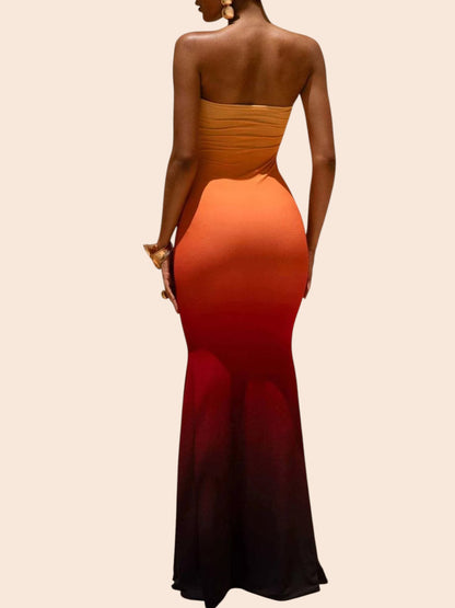 My Store strapless mermaid maxi dress in a vibrant orange to dark red ombre print with a curve-skimming silhouette.