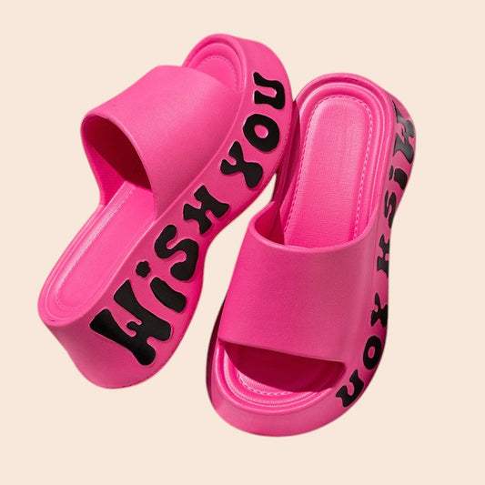 My Store pink Miss Girl platform slide sandals with black Wish You lettering on the chunky EVA sole