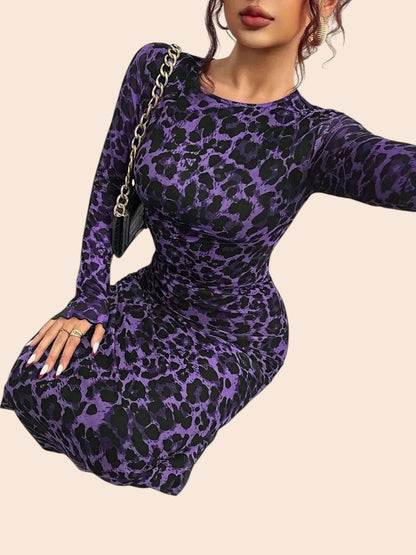 My Store purple and black leopard print long sleeve mesh maxi dress with ruched detailing worn by a woman.