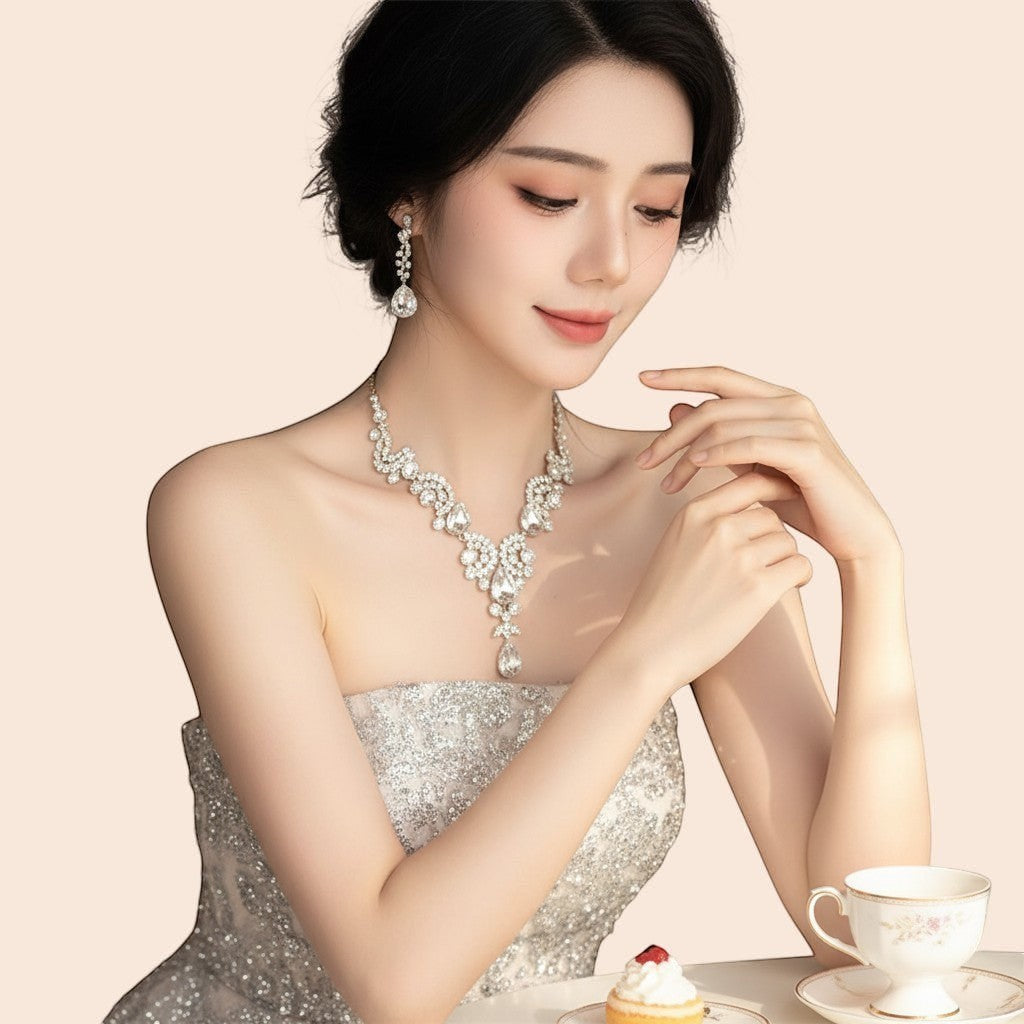 My Store 3-piece rhinestone necklace and earrings set with waterdrop and tassel details. Vintage court style.