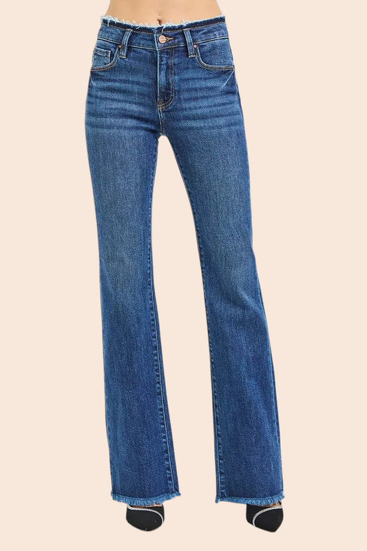 My Store RISEN dark blue bootcut jeans featuring a unique frayed waistband and raw hem detail on a model.