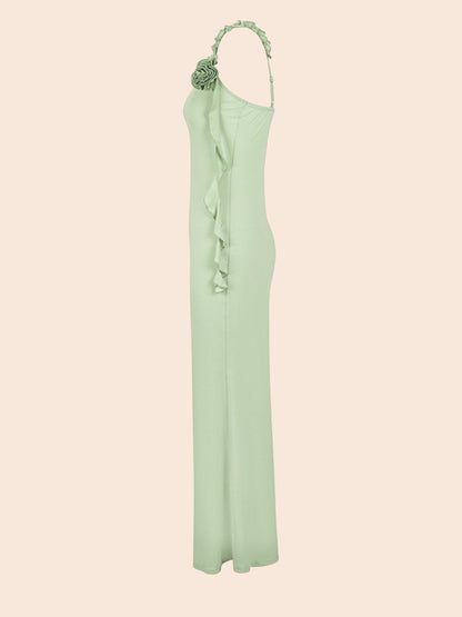 My Store sage green maxi dress featuring delicate floral appliqué on the shoulder and a cascading side ruffle detail.