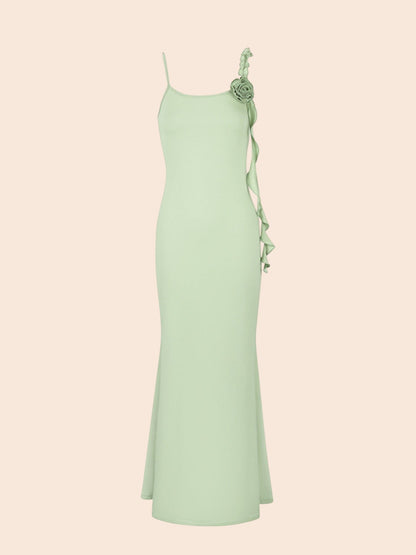 My Store sage green mermaid maxi dress featuring delicate floral appliqué on the shoulder and cascading side ruffles.