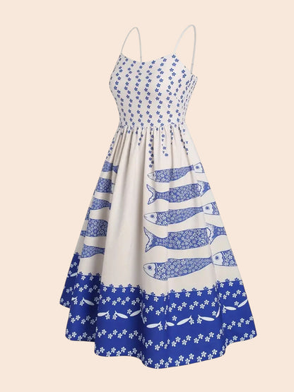 My Store blue and white midi dress with a sardine graphic print, spaghetti straps, and a smocked bodice.