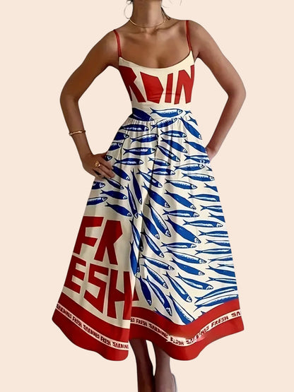 My Store sardine graphic print midi dress with a smocked bodice, spaghetti straps, and a flowy skirt in red and blue.