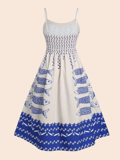 My Store white midi dress with blue sardine graphic print, spaghetti straps, and a smocked bodice.
