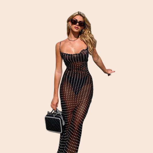 My Store sheer black mesh maxi dress with white polka dots, spaghetti straps, and a flattering scoop neckline.