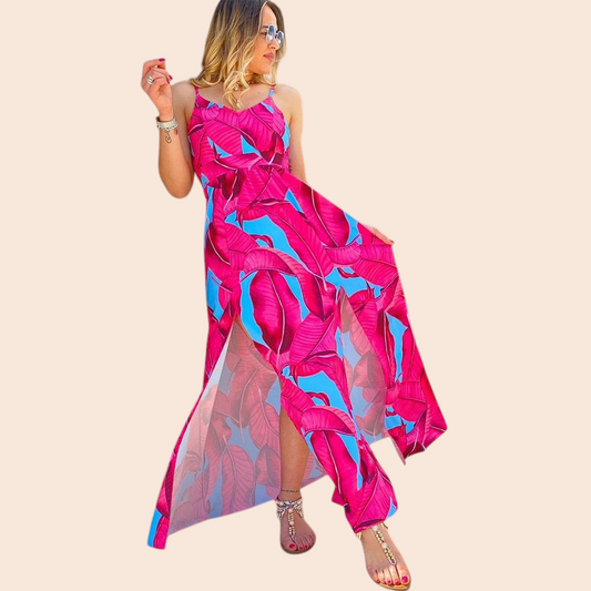 My Store tropical print maxi dress with pink and blue botanical pattern, open back, and front slit on a woman.