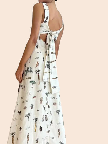 My Store white maxi dress with whimsical vacation print, sleeveless design, and an open back with an adjustable tie.
