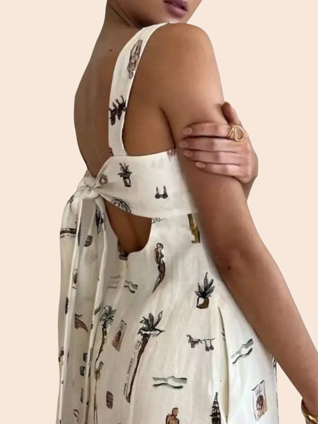 My Store whimsical print maxi dress with sleeveless bodice and adjustable tie-back detail on a model